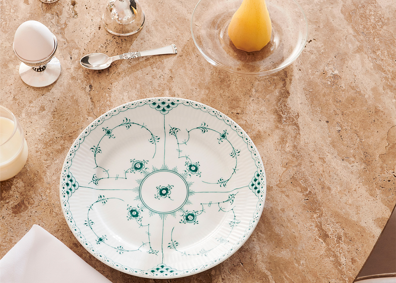 The handcrafted and hand-painted Emerald Fluted half Lace 22 cm plate in a breakfast setting